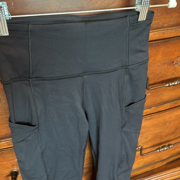 Lululemon black leggings. EUC. Size 4. Full length. Side and waist pockets. - Picture 2 of 5
